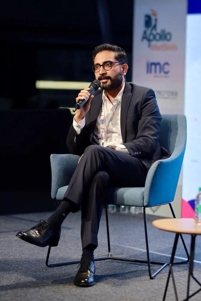 Richard Roy Mendonce speaking on stage at the 4th Edition Healthcare Summit 2024 in Hyderabad